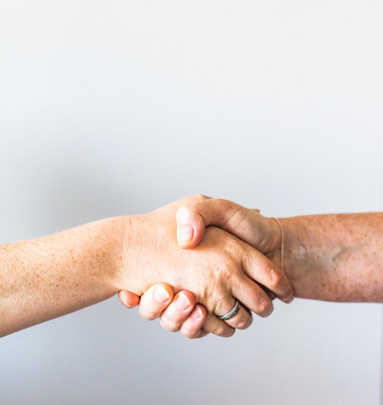 person holding hands of another person